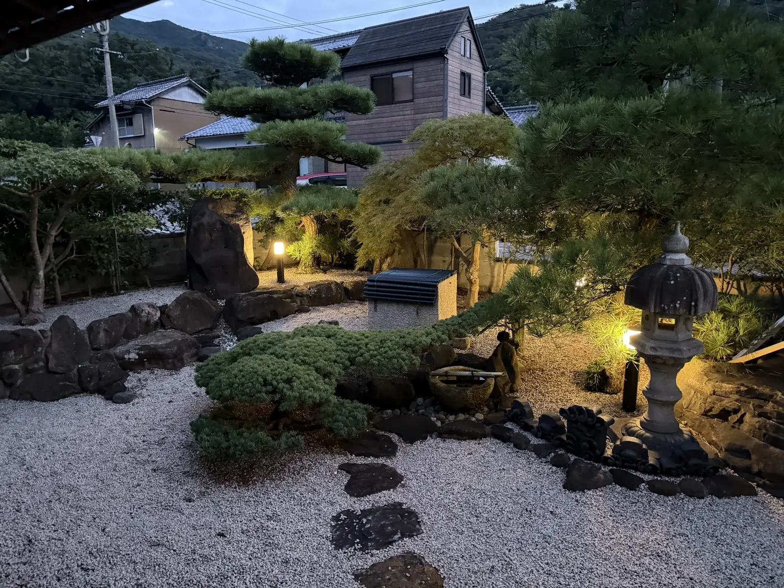 The Hanare garden. The stone lantern is lit in the evening.